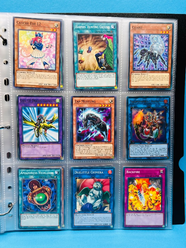 Photo 1 of 812256… final sale no returns/refunds -135 mixed Yu-Gi-Oh cards in binder -some holo