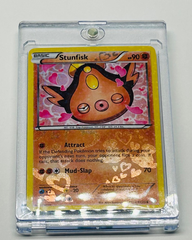 Photo 2 of 812285… Pokémon reverse holo card in hard plastic case Stunfisk