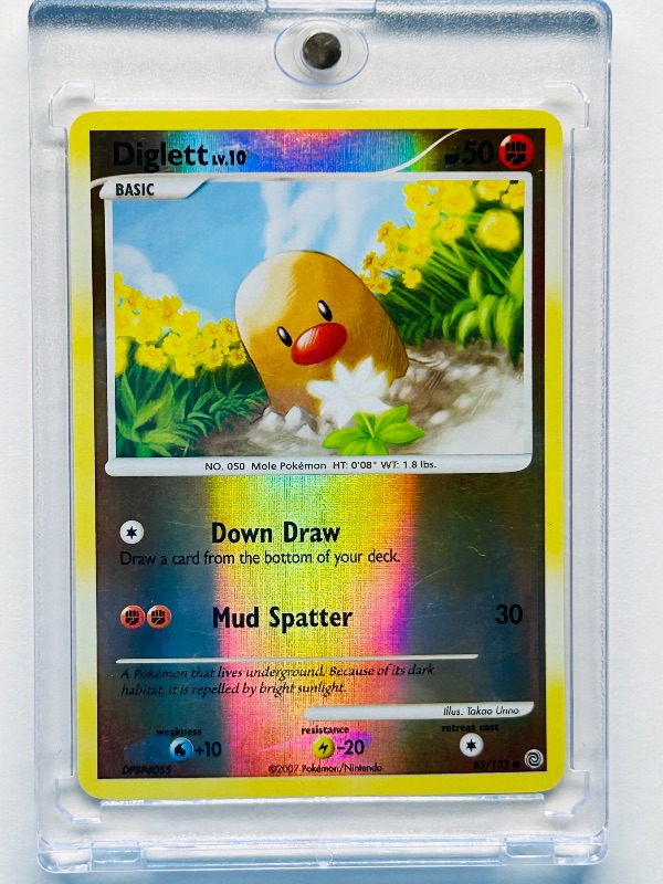 Photo 1 of 812291… Pokémon reverse holo card in hard plastic case Diglett