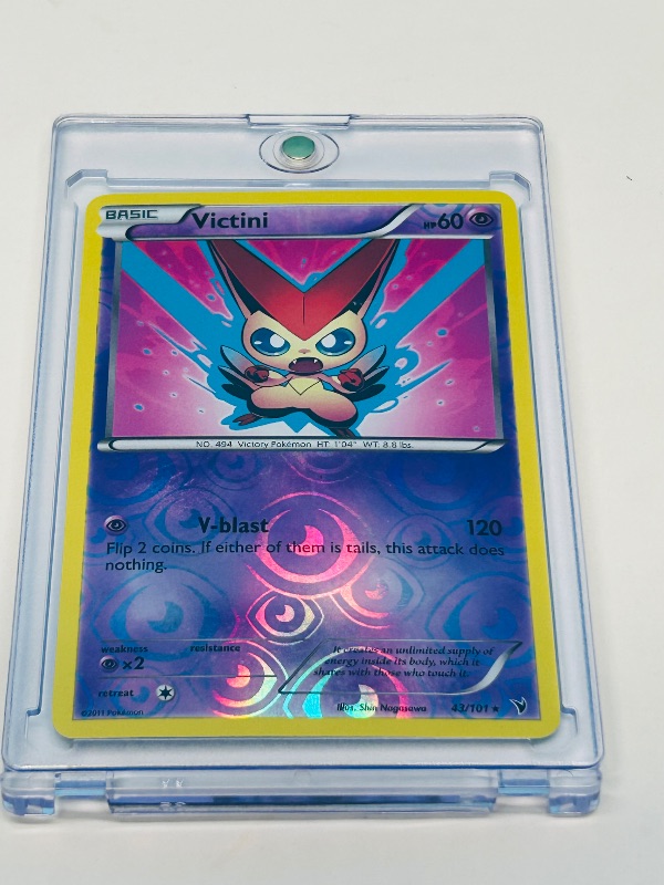 Photo 2 of 812316…  Pokémon reverse holo card in hard plastic case Victini