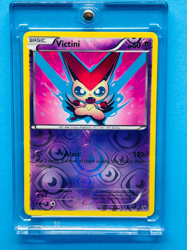 Photo 1 of 812316…  Pokémon reverse holo card in hard plastic case Victini