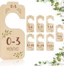 Photo 1 of Baby Closet Dividers for Clothes Organizer - Set of 8 Beautiful Wooden Double-Sided Baby Clothes Size Hanger Organizer from Newborn to 24 Months for Boho Nursery Decor