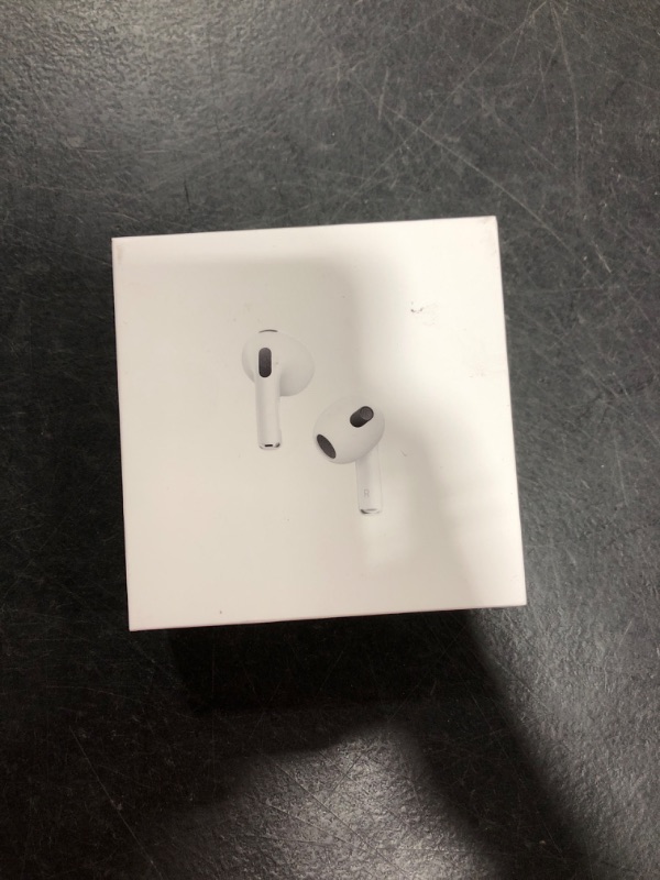 Photo 2 of Apple AirPods (3rd Generation) Wireless Ear Buds, Bluetooth Headphones, Personalized Spatial Audio, Sweat and Water Resistant, Lightning Charging Case Included, Up to 30 Hours of Battery Life Without AppleCare+