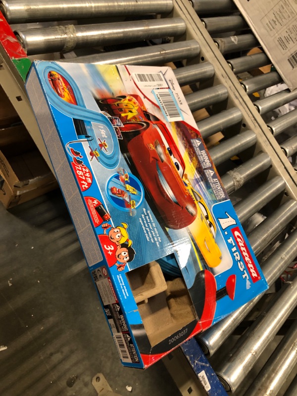 Photo 2 of Carrera First Disney/Pixar Cars - Slot Car Race Track - Includes 2 Cars: Lightning McQueen and Dinoco Cruz - Battery-Powered Beginner Racing Set for Kids Ages 3 Years and Up Disney Cars w/ Spinners