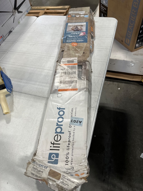 Photo 2 of Arnica Lake Oak 7.13 in. W x 48.03 in. L Waterproof High Traffic Luxury Vinyl Plank Flooring (19.05 sq. ft./case) **edges are cracked due to package being opened**