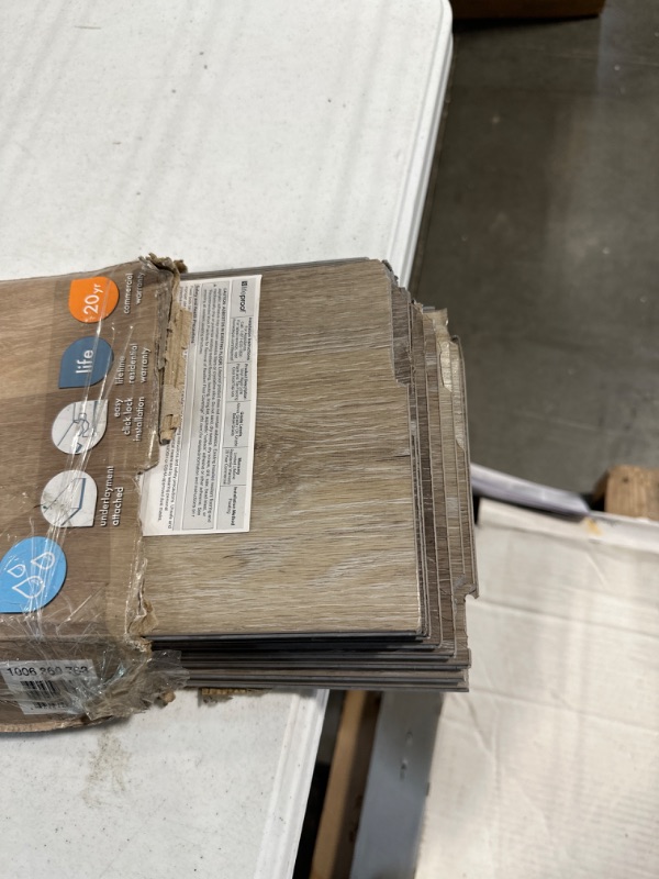 Photo 3 of Arnica Lake Oak 7.13 in. W x 48.03 in. L Waterproof High Traffic Luxury Vinyl Plank Flooring (19.05 sq. ft./case) **edges are cracked due to package being opened**