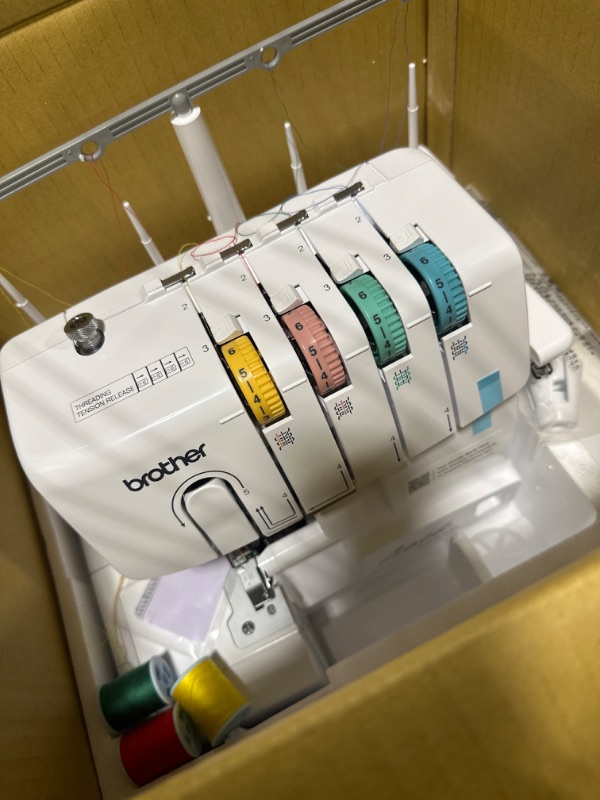 Photo 1 of Brother Serger, 1034D, Heavy-Duty Metal Frame Overlock Machine, 1,300 Stitches Per Minute, Removeable Trim Trap, 3 Included Accessory Feet,White