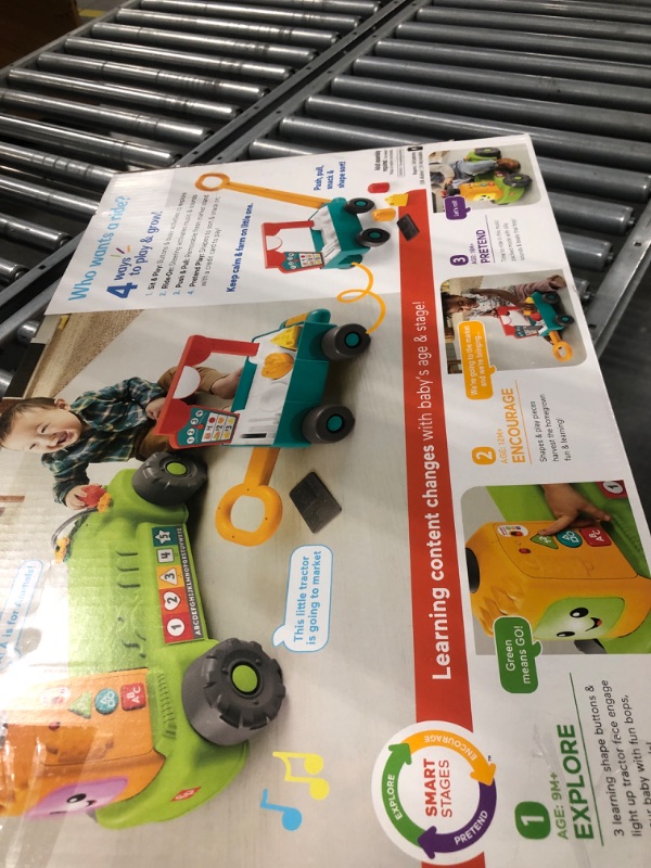 Photo 1 of Fisher-Price Laugh & Learn Baby to Toddler Toy, 4-in-1 Farm to Market Tractor Ride On with Pull Wagon & Smart Stages for Ages 9+ Months