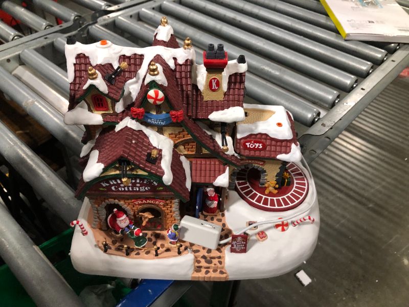 Photo 5 of Lemax 95462 Kringle's Cottage, New 2019 Santa's Wonderland Village Sights & Sounds Collection, Polyresin Decorated Miniature Building & Figurines, X'mas Decor/Gift/Collectible, 9.45"x11.61"x8.27"