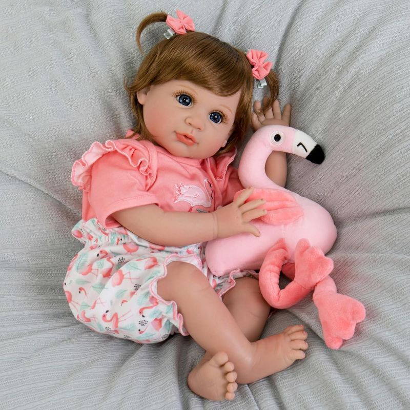 Photo 1 of Aori Reborn Baby Girl Doll,22 in Realistic Newborn Baby Dolls,Adorable Lifelike Babies,Weighted Reborn Toddler with Flamingo Toy Gifts Set for Kids 3 Year Old