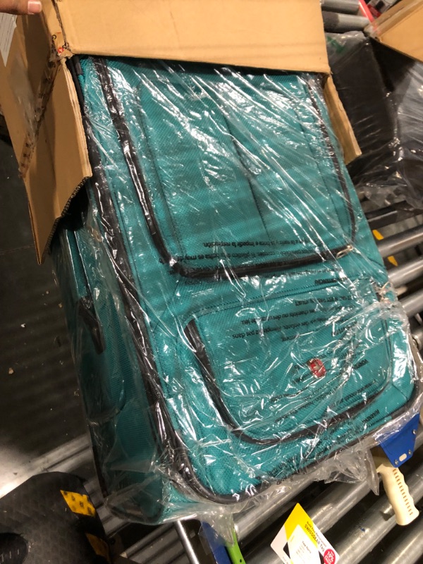 Photo 3 of ***STAINED ON FRONT*** 

SwissGear Sion Softside Expandable Roller Luggage, Teal, Checked-Medium 25-Inch Checked-Medium 25-Inch Teal