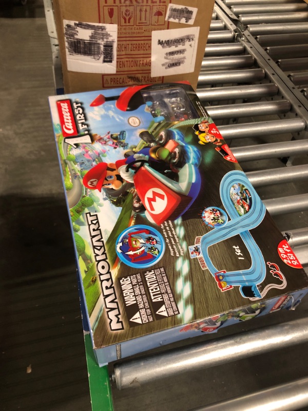 Photo 4 of Carrera First Nintendo Mario Kart Slot Car Race Track - Includes 2 Cars: Mario and Luigi and Two-Controllers - Battery-Powered Beginner Set for Kids Ages 3 Years and Up, 20063028 Mario Kart / Flippers