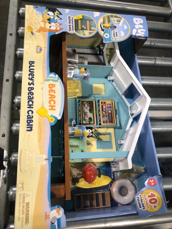 Photo 3 of BLUEY Beach Cabin Playset, with Exclusive Figure with Goggles. Includes 10 Play Pieces and Sticker Sheet