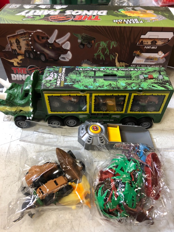 Photo 2 of BLUEJAY 21 Pack Dinosaur Toys for Kids 3-7, Dinosaur Truck with Oversized Dinosaur Map, Flashing Lights, Music and Roaring Sound, Kids Toys with 6 Pull Back Dinosaur Cars, 6 Dinosaur Toys (Green)