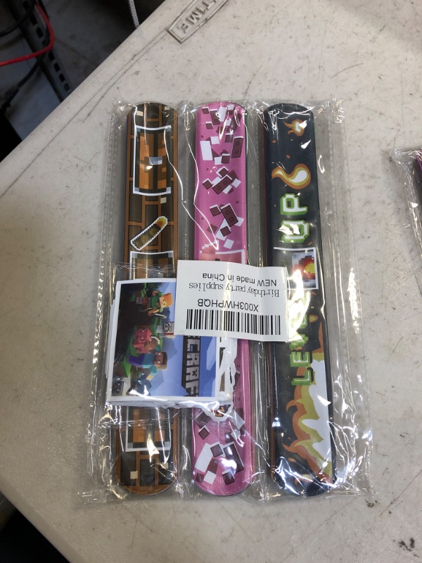 Photo 2 of Aojoeheao 82Pcs Birthday Party Favors,Slap Wristband Set,include 32Pcs Slap Wristband and 50Pcs Stickers,Best for the Goodie Bags for Game Themed Birthday Party