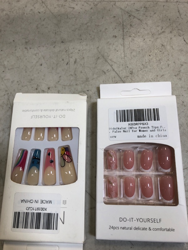 Photo 1 of 2 packs of press on nails