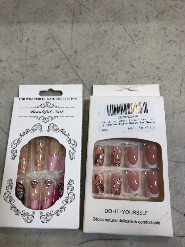 Photo 1 of 2 packs of press on nails