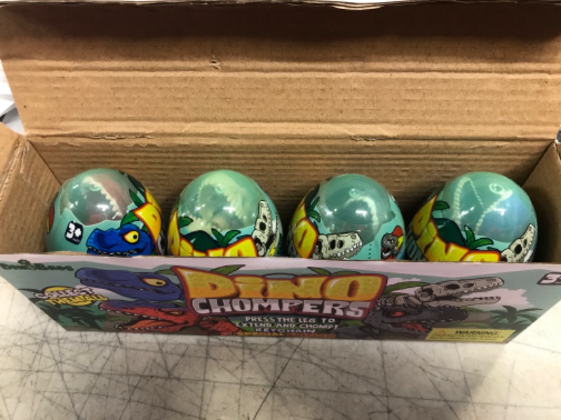 Photo 2 of DINOBROS Surprise Eggs with Dinosaur Toys Inside, 4 Plastic Egg Toys Filled with Dino Chomper Keychains Birthday Party Favors for Boys and Girls