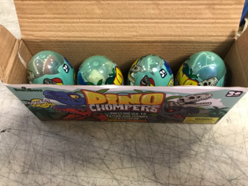 Photo 2 of DINOBROS Surprise Eggs with Dinosaur Toys Inside, 4 Plastic Egg Toys Filled with Dino Chomper Keychains Birthday Party Favors for Boys and Girls