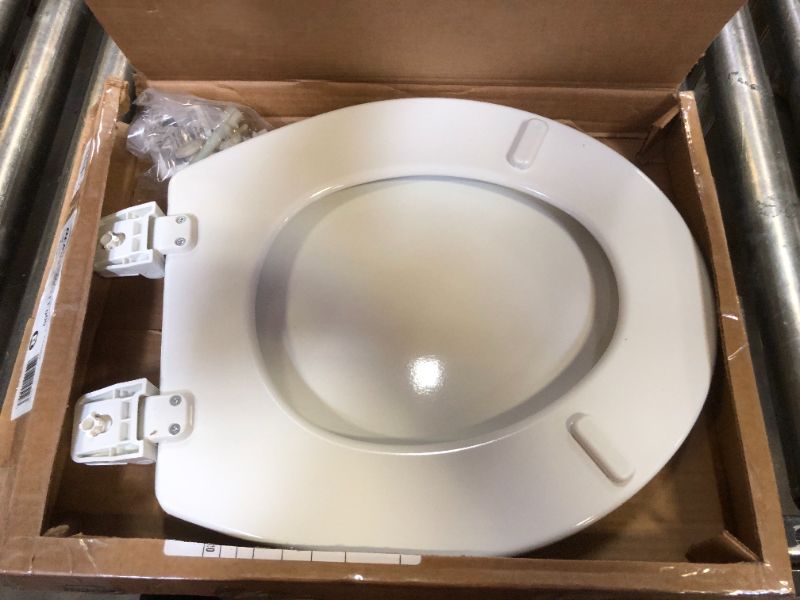 Photo 2 of BEMIS ADJUSTABLE ROUND CLOSED FRONT ENAMELED WOOD TOILET SEAT IN WHITE
