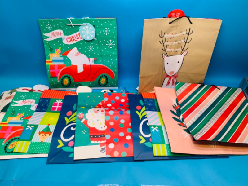 Photo 1 of 985718… 12 Xlarge Christmas gift bags 