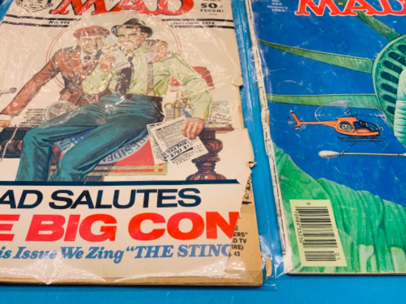 Photo 2 of 985974… condition issues- 6 vintage MAD magazines in sleeves- wear, rips, stains