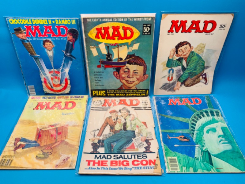 Photo 1 of 985974… condition issues- 6 vintage MAD magazines in sleeves- wear, rips, stains