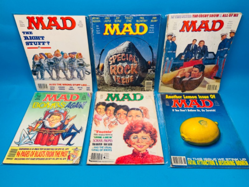 Photo 1 of 985975… condition issues- 6 vintage MAD magazines in sleeves- wear, rips, stains