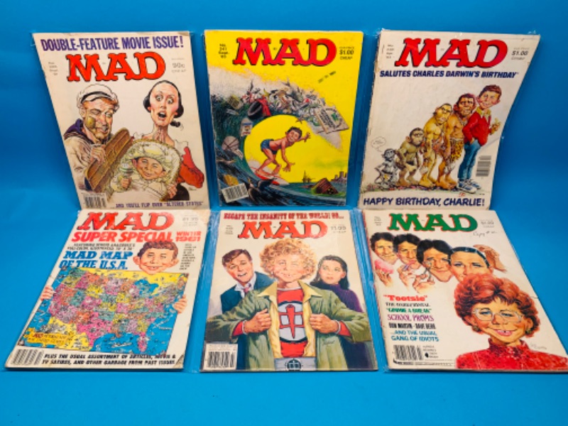 Photo 1 of 985976… condition issues- 6 vintage MAD magazines in sleeves- wear, rips, stains