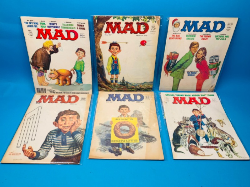 Photo 1 of 985977… condition issues- 6 vintage MAD magazines in sleeves- wear, rips, stains