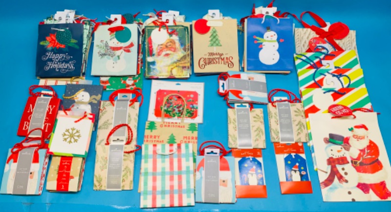 Photo 1 of 986343…approx 100 small, xsmall  and gift card size Christmas gift bags 