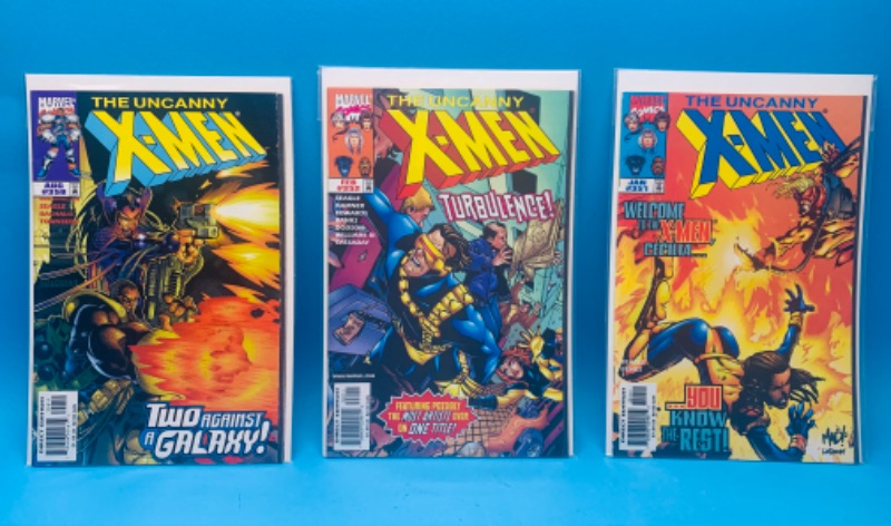 Photo 1 of 986504…3 X-men comics in plastic sleeves 