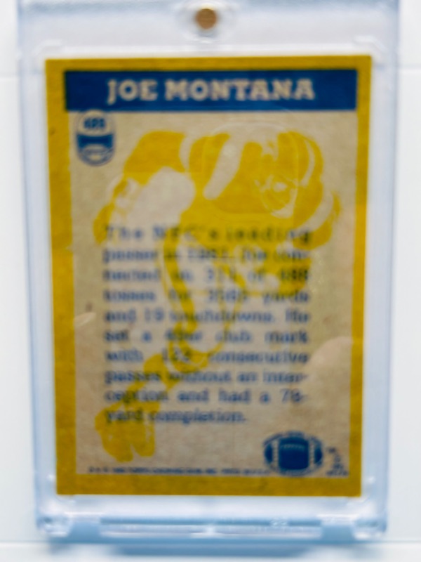 Photo 2 of 987392…topps Joe Montana in action card 489  in hard plastic case