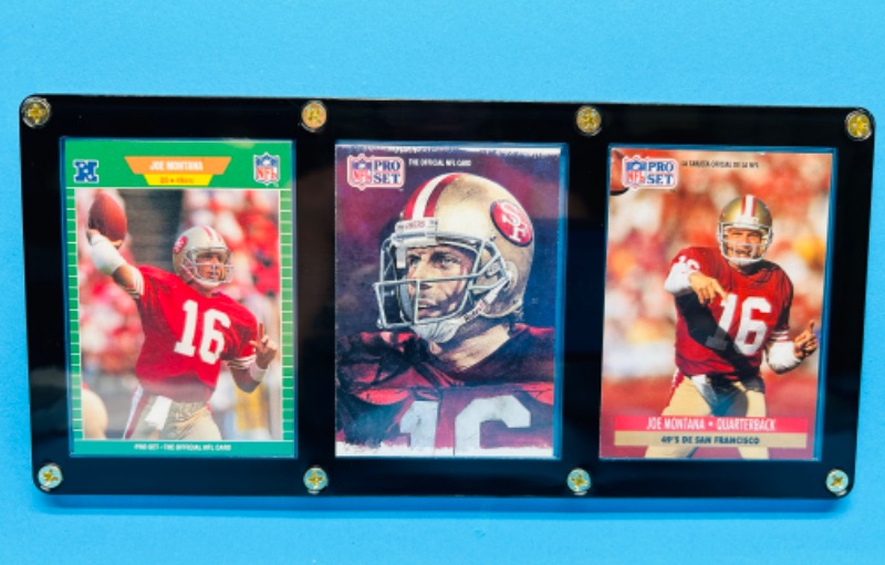 Photo 1 of 987475…3 Joe Montana cards in display case