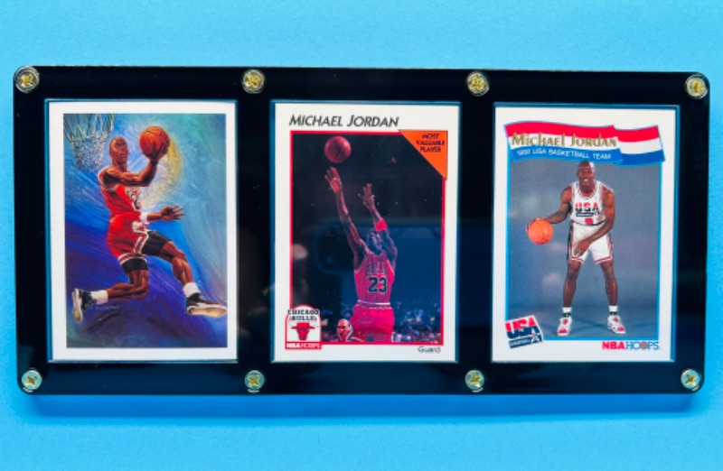 Photo 1 of 987499…3 Michael Jordan cards in display case