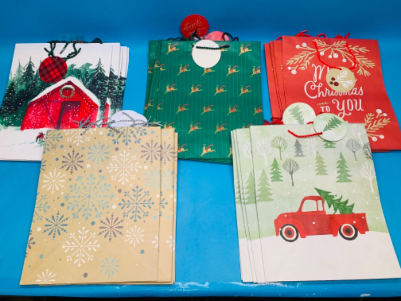 Photo 1 of 988064…25 large Christmas gift bags 