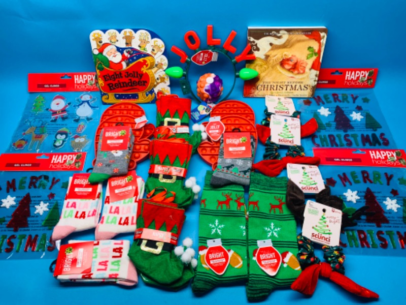 Photo 1 of 988239…Christmas and holiday items- socks, fidgets, books, and more