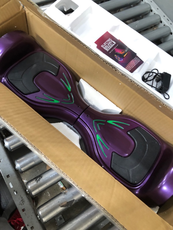 Photo 2 of ***USED - NO CHARGER - UNABLE TO TEST***
Bluetooth Hoverboard with Pearl Skin, 6.5" Self Balancing Scooter with Wireless Speaker for Music, with LED Light up Pedal and Wheels for Funs Purple