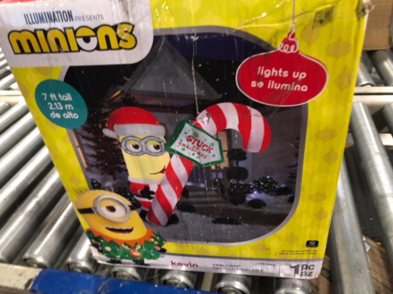 Photo 4 of Gemmy 7Ft. Tall Christmas Inflatable Minion Kevin Holding Candycane Indoor/Outdoor Holiday Decoration
