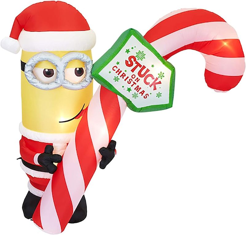 Photo 1 of Gemmy 7Ft. Tall Christmas Inflatable Minion Kevin Holding Candycane Indoor/Outdoor Holiday Decoration
