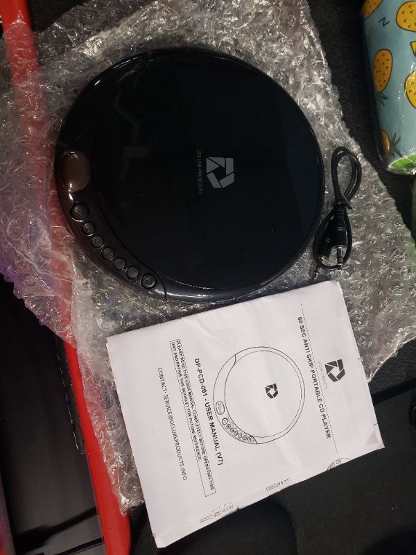 Photo 1 of LOOKS NEW
Deluxe Products CD Player Portable with 60 Second Anti Skip, Stereo Earbuds, Includes Aux in Cable and AC USB Power Cable for use at Home or in Car Black_CD