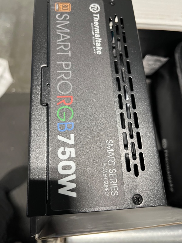 Photo 1 of Thermaltake Smart Pro RGB 750W Smart Zero Fan SLI/CrossFire Ready Continuous Power ATX12V v2.4 / EPS v2.92 80 PLUS Bronze Certified Full Modular Power Supply