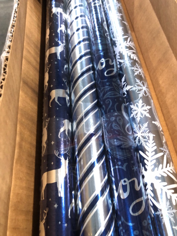 Photo 1 of American Greetings 80 sq. ft. Blue Wrapping Paper Bundle for Christmas, Hanukkah and All Holidays, Blue and White Stripes (4 Rolls 30 in. x 8 ft.) Blue and Silver
