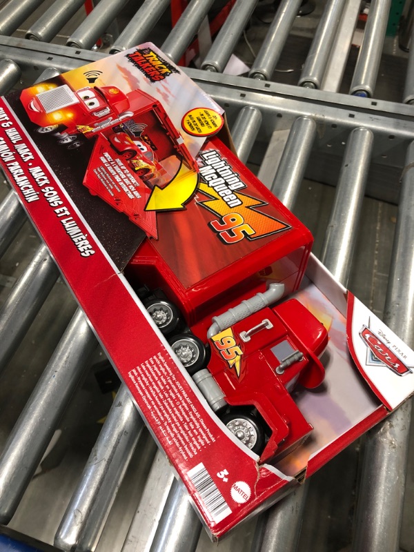 Photo 3 of Disney Car Toys Track Talkers Toy Truck, Chat & Haul Mack Hauler with Lights & Sound, Stores 2 Cars, 17 Inch Simplified Packaging