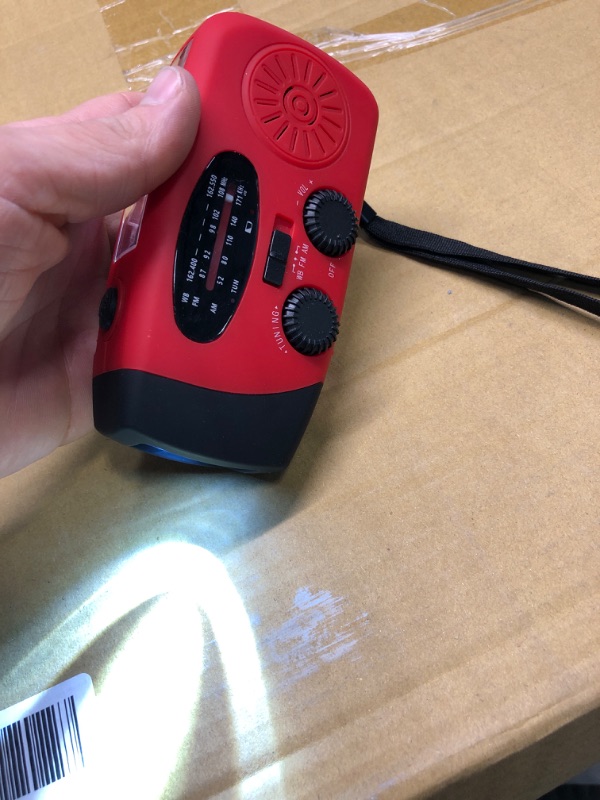 Photo 3 of RADIO WORKS, LIGHT WORKS, CRANK WORKS.
Emergency Hand Crank Radio with LED Flashlight for Emergency, AM/FM NOAA Portable Weather Radio with 2000mAh Power Bank Phone Charger, USB Charged & Solar Power for Camping, Emergency Red
