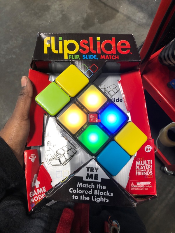 Photo 2 of Flipslide Game, Electronic Handheld Game | Flip, Slide, and Match the Colors to Beat the Clock - 4 Game Modes - Multiplayer Fun