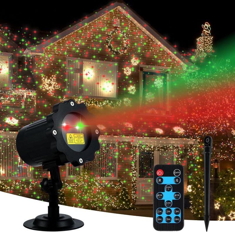 Photo 1 of Christmas Projector Lights Outdoor, Waterproof Christmas Decorations Led Lights Projector with Remote Control Timer Indoor Firefly Lights for Xmas Yard Garden Holiday Party Home Decor Landscape Patio
