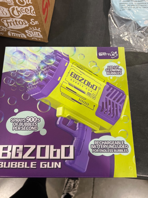 Photo 2 of Bazooka Bubble Gun, Bubble Machine with 2 Batteries, LED Lights, 69 Holes Bubble Machine Gun for Kids Ages 3 4 5 6 7 8 Boy Girl Birthday Party Favors Toddler Outdoor Toys - Bubble Blower Purple Purple Bubble Gun