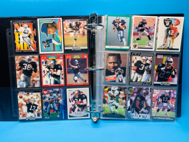 Photo 1 of 150039…90 misc Raiders trading cards in binder