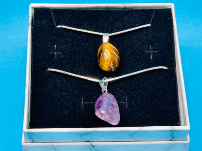 Photo 1 of 150213…  2 polished rock pendants on chains in gift box
